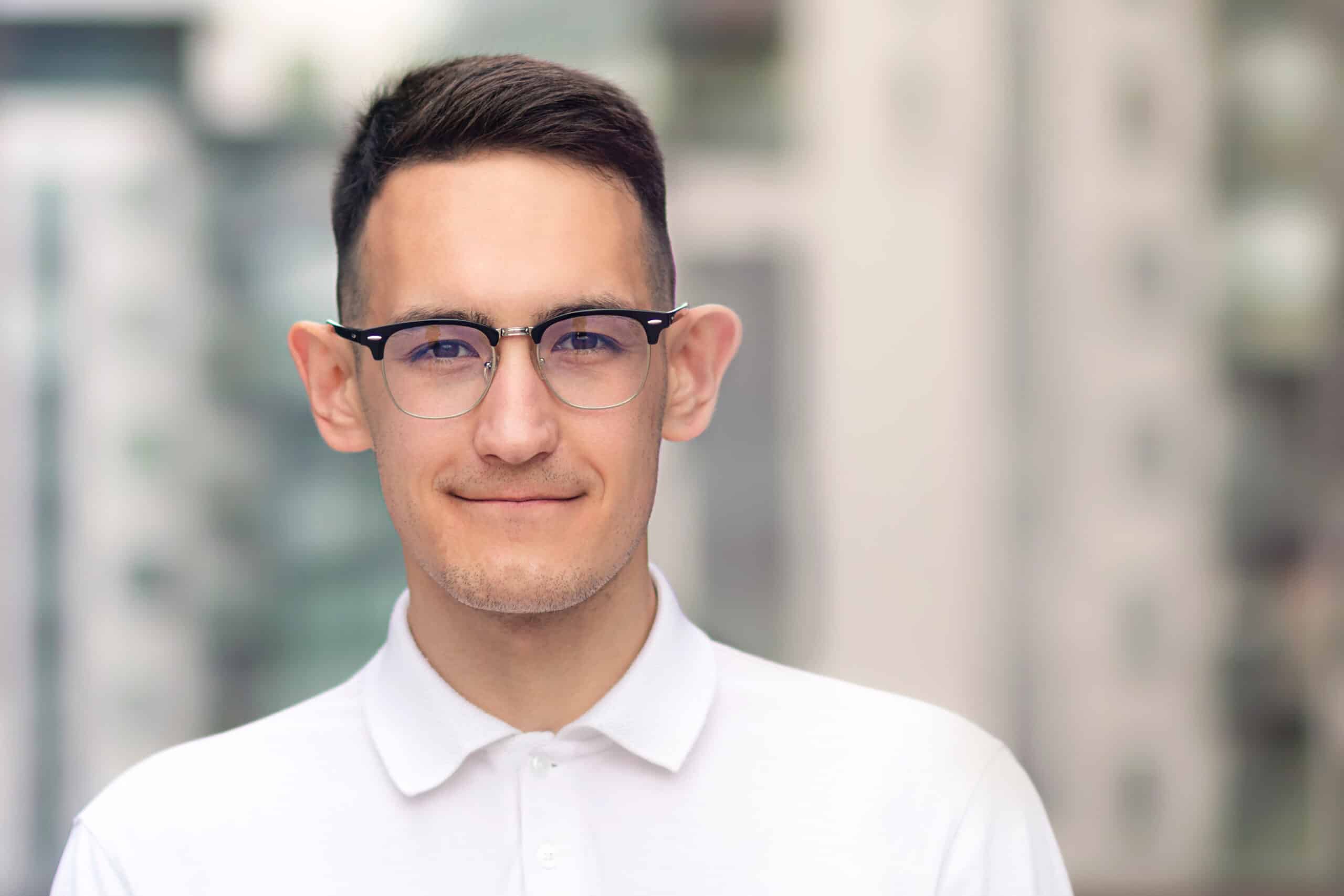 Portrait,Of,Intelligent,Smart,Guy,In,Glasses,And,White,Shirt.Otoplasty candidate,