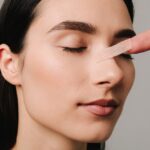Rhinoplasty.,Applying,Bandage,On,Nose,After,Surgery,To,Support,Its