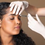 Cosmetologist,Making,Botox,Injection,In,Interbrow,Zone,To,Latin,Chubby